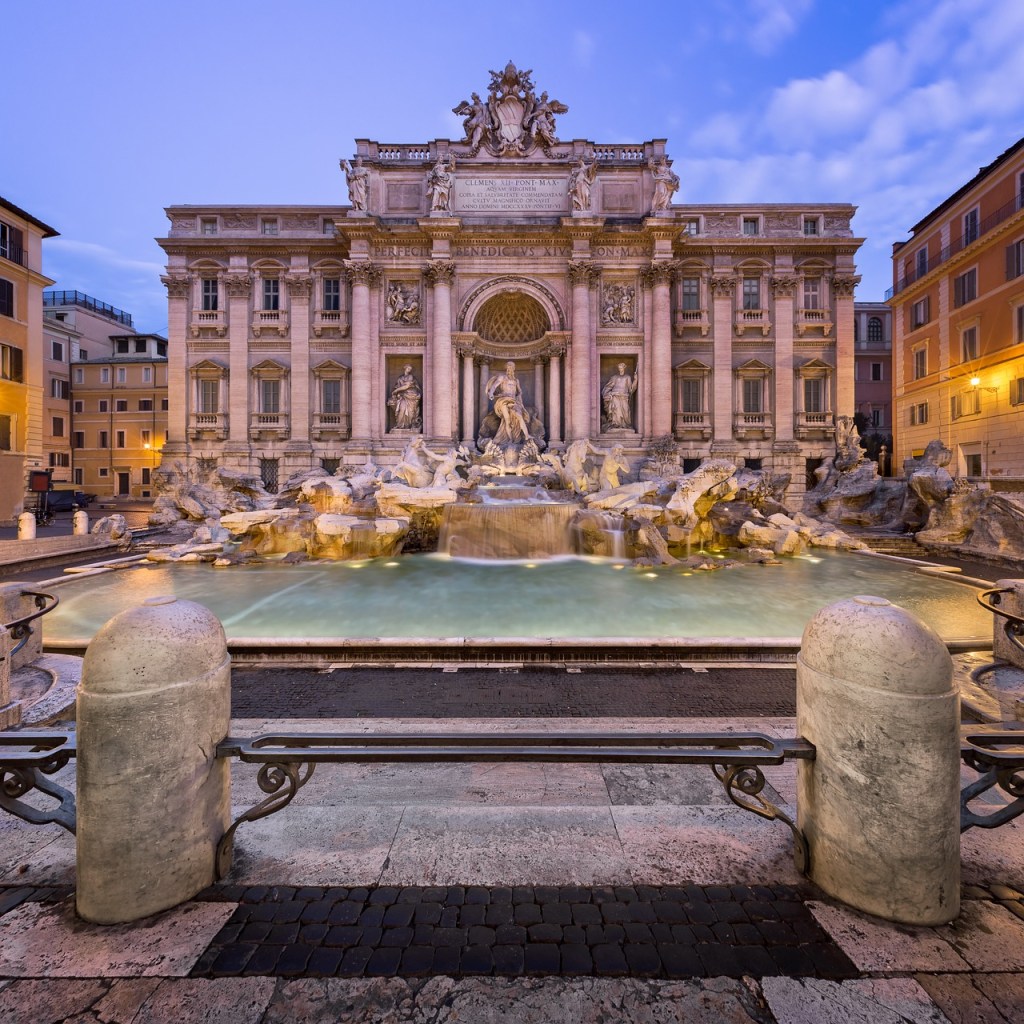 A mesmerizing snapshot of the Trevi Fountain in Rome, where cascading waters dance against a backdrop of exquisite Baroque sculpture, capturing the essence of eternal beauty and timeless wishes.
